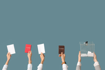 Canvas Print - Hands holding ballot box, passports and voting papers on blue background. Election concept