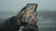 © jobim - a hand holding a smartphone displaying a visually striking design. screen showcases an intricate network of glowing connections and bright nodes that resemble a starry sky or a digital constellation