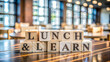 © Uttara Graphic - Lunch and learn symbol. Wooden blocks with concept words Lunch and learn