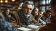 © Doukdouk/imageBROKER - An elderly, bearded man reading a book in a cozy library environment, AI generated