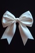 © Ева Поликарпова - A simple white bow against a dark backdrop