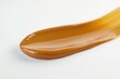 © Ева Поликарпова - A close-up of a spoon holding a small amount of liquid on a white surface