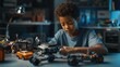 © Business Pics - Happy school boy student making robotic car sitting at table at STEM class. Diverse children learning programming using computers and constructing robots at science and coding education tech lesson.
