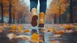 © O - Woman in yellow boots walking through autumn leaves on a rainy day