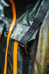 Wall Mural - A detailed shot of a backpack with green and yellow accents