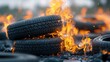 © Moopingz - Burning tires create a dramatic scene with flames engulfing stacked rubber, highlighting the intensity of fire in an industrial setting.