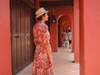 © YURII Seleznov - Young woman in ethnic dress and hat exploring the vibrant streets of Malacca, Malaysia. A blend of cultural heritage, colorful architecture, and tropical charm. Perfect travel and lifestyle moments.