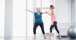 © peopleimages.com - Yoga, instructor and help woman with stretching for fitness, body health or warrior pose for senior wellness. Assistance, pilates coach or exercise together for balance, physiotherapy or smile in gym