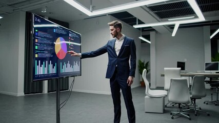 Leinwandbilder - Business professional analyzes data on futuristic digital display in modern office setting