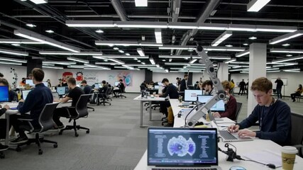 Fototapete - Innovative minds collaborate in a modern workspace with holographic displays and VFX technology