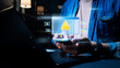 © Ar_TH - A person using a smartphone while receiving multiple cybersecurity warning alerts. Digital security risk icons appear in a futuristic interface, symbolizing hacking threats.