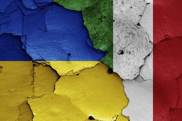 Wall Mural - Flags of Ukraine and Italy painted on cracked wall