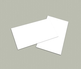 Two blank white business cards on a light gray background, White blank business card on background