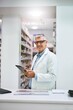 © peopleimages.com - Pharmacy, medicine and man on digital tablet for stock inventory, system and database update in portrait. Mature doctor or retail pharmacist with technology for virtual, medical and online services