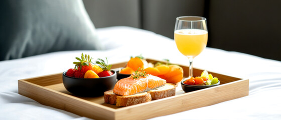 Wall Mural - A beautifully arranged breakfast tray featuring salmon, fresh fruits, and a glass of orange juice, set against a cozy background.