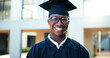 © Siphosethu/peopleimages.com - Portrait, black man and smile at graduation outdoor, education achievement and qualification ceremony. Happy, male student and studying success of university degree, celebration and academic progress