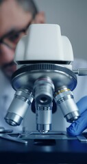 Wall Mural - scientist is meticulously examining biological sample through an advanced hightech microscope device