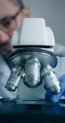 Wall Mural - scientist is meticulously examining biological sample through an advanced hightech microscope device