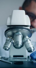 Wall Mural - scientist is meticulously examining biological sample through an advanced hightech microscope device