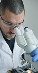 Wall Mural - dedicated researcher concentrating on detailed microscopic analysis within wellequipped laboratory e