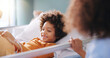 © Siphosethu/peopleimages.com - Kid, mother and smile in hospital bed with teddy bear for healthcare, medical support or surgery recovery. Mom, sick child and happy patient with toy for play, hand and healing illness with family
