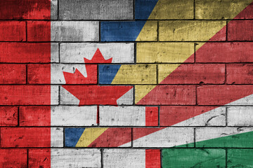 Wall Mural - colourful painted big flag of canada and flag of seychelles on a massive old brick wall background. concept