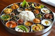 © Umnat - Enjoy a diverse assortment of dishes typical of West Bengal, India, with an authentic thali meal.