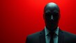 © Tyoma - A man in a suit and tie stands in front of a red background