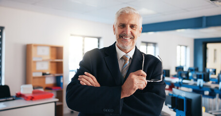 Fototapete - Mature man, portrait and lecturer with glasses in classroom for IT program, course or education at institution. Male person, teacher or technology professor with smile or arms crossed for learning