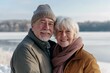 © Markus Schröder - Portrait of a merry couple in their 60s showing off a lightweight base layer while standing against backdrop of a frozen winter lake