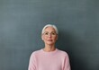 © Ryzhkov - Timeless Elegance in Professional Portrait Mature Model in Soft Pink Knitwear Against Charcoal Chalkboard for Modern Branding and Business Identity