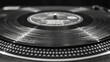 © PuriStudio - close up view of black vinyl record showcases its smooth surface and intricate grooves, evoking nostalgia and musical memories