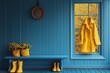 © Stanislav - A bright yellow raincoat hanging by the window adds a cheerful touch to this blue room, perfect for rainy days. This cozy scene invites comfort and warmth.