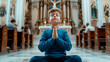 © Daniella - Young Boy Praying in Church Interior