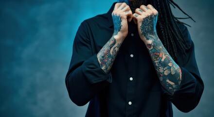 Wall Mural - Man with intricate tattoos showcasing his style and personality