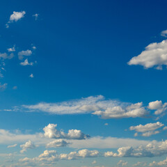 Wall Mural - white fluffy clouds on blue sky.