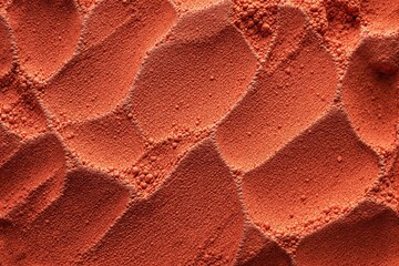 Wall Mural - Abstract close-up of textured red sand with geometric patterns.