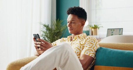 Fototapete - Man, student and phone on couch at house of education results, university application and social media. Male person, mobile and website with college registration scholarship feedback and notification