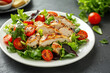 © Jonki - Appetizing summer salad with meat, tomatoes, basil and lettuce, healthy summer breakfast in a white plate on the table, healthy food concept, weight loss food