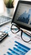 © spyrakot - Financial Analysis Tools: Ledger, Tablet, Glasses, and Calculator for Professional Workspace Design
