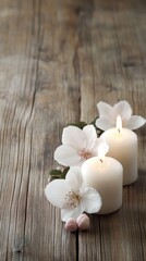 Canvas Print - Softly glowing candles surrounded by pink flowers create a calming ambiance on a wooden surface, perfect for relaxation or decor