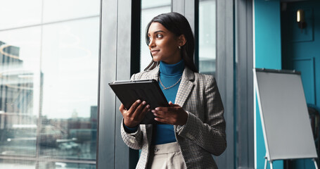 Wall Mural - Thinking, tablet and window with business woman in office for workshop coordinator, reflection and corporate trainer. Vision, planning and conference organizer with person in agency for schedule