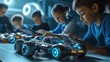 © Johannes - Multiracial school kids students making robotic cars using tablet computer. Diverse junior children pupils building robot vehicle learning at table at STEM code ai engineering science education class