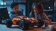 © Johannes - Diverse school children students build robotic cars using computers and coding. Happy multiethnic kids learning programming robot vehicles sitting at table at STEM education science engineering class