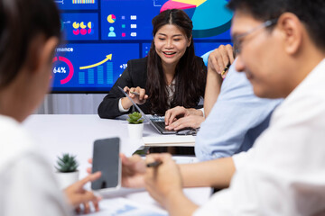 Fototapete - Analyst team utilizing BI Fintech to analyze financial data at table in meeting room. Businesspeople analyzing BI dashboard power for business insight and strategic marketing planning. Prudent