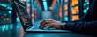 © Vadym - Person types on laptop in server room. Focus on hands typing on keyboard. Person works on website design. Tech background shows data center. Modern tech concept. Pro work environment. Looks like web