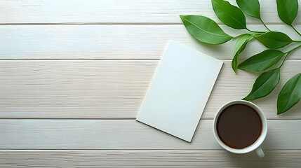 Wall Mural - blank notepad, coffee cup, green leaves on wood; flatlay mockup