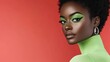 © Konstiantyn Zap - Portrait of african female with green eye makeup and earrings against red background