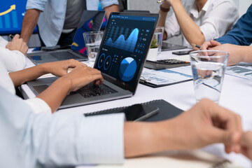 Fototapete - Analyst team utilizing BI Fintech to analyze financial data at table in meeting room. Businesspeople analyzing BI dashboard power for business insight and strategic marketing planning. Prudent