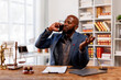 © David - Excited African American Man Lawyer talking on telephone and gesturing in office
